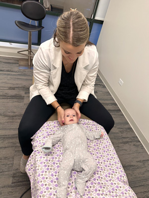 Chiropractor Chicago IL Brittany Hennigan Adjusting Infant